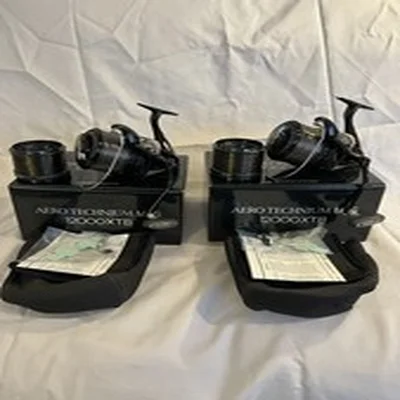 2x Shimano Aero Technium MGS 12000 XTB Black Fishing Reels with spare spools 