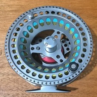 A SUPERB AIRFLO AIRLITE #10/12 SALMON FLY REEL A LARGE LIGHT SALMON REEL LINE ON