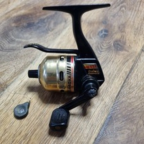 Daiwa spinning reel, closed face spool, underspin trigger cast 