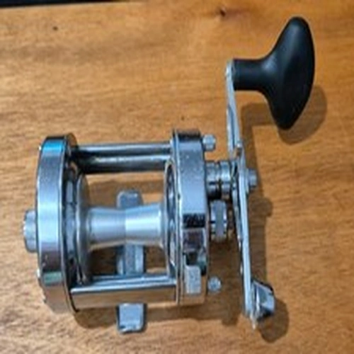 A ABU AMBASSADEUR 6500CT CHROME ROCKET WITH PAPER WORK AND BOXED WORKS WELL