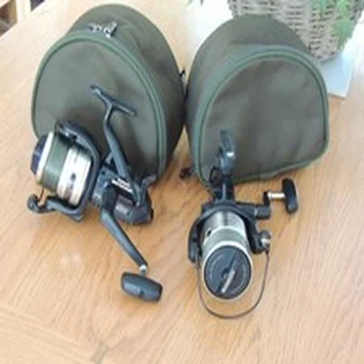 2 Shimano Baitrunner Reels Plus Cases.