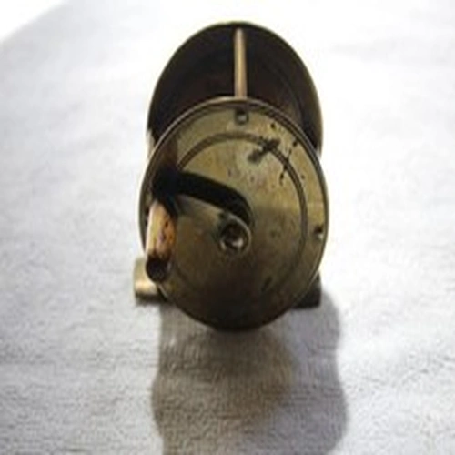84. A small Brass Poachers Centrepin Reel