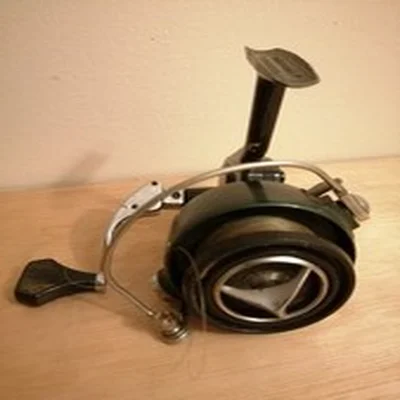 Vintage fixed spool fishing reel. Fair used condition.