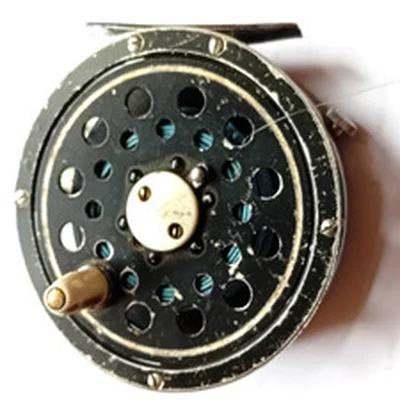 Vintage fly fishing reel with line