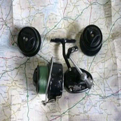 A Mitchell 300 Reel with Two Spare Spools