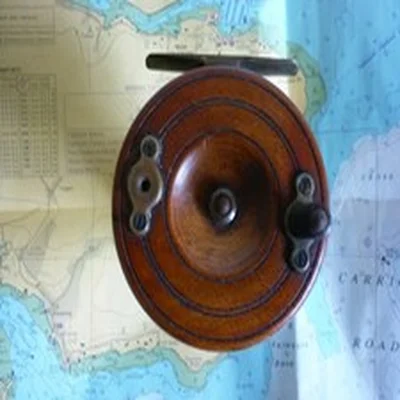 A Really Nice 3 inch, Wood and Brass, Starback Reel.