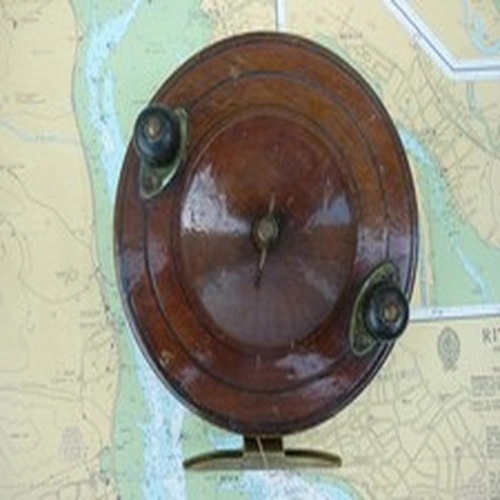 A 6 inch Wood & Brass Centre Pin Reel