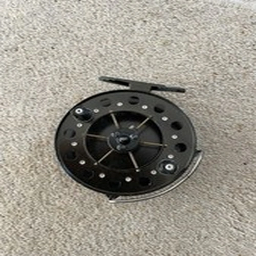 I believe this to be a Vintage Mordex Merlin reel Plus a case