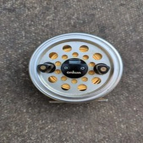 A DAIWA 732 DOUBLE HANDLED FLY FISHING REEL With Line