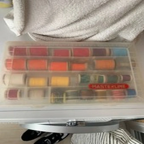Box of Gudebrods plus other fishing rod whipping various sizes and gauges.