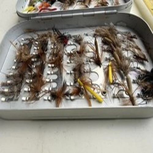 A vintage Okuma fly box with dry flies.