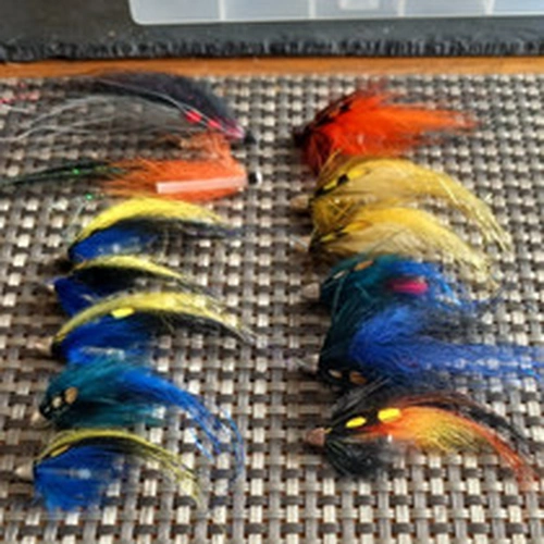 LURE BOX FULL OF CONE HEAD TUBE FLIES .