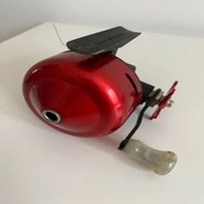 Abumatic 60 closed face Fishing Reel - red