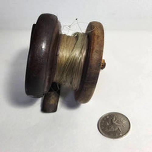 Old wooden fishing reel 2" deep x 3inch diameter, missing an original  handle