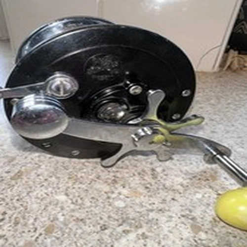 Vintage 1952-54 Penn No.66 Long Beach Reel - Plain Plates Yellow Handle
