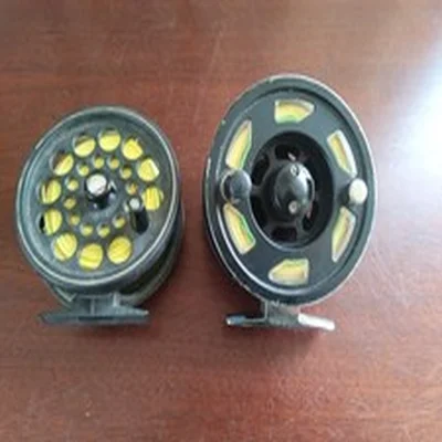 2 X VINTAGE FLY FISHING REELS 1 IS A SKORPIO AND THE OTHER ONE DONT KNOW MAKE.