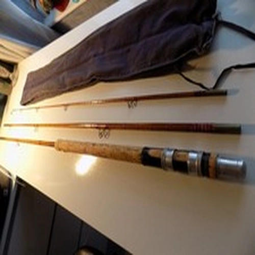 Vintage split cane Eric Thackeray fishing rod with bag