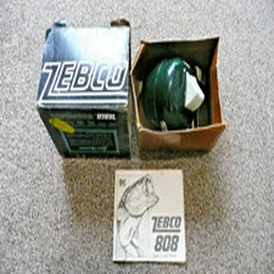 RARE VINTAGE ZEBCO 808 SPIN CAST DARK GREEN FISHING REEL & MANUAL