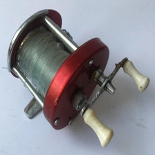 Old red casting fishing reel