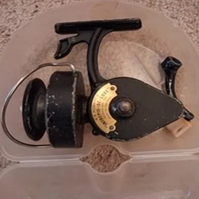 A boxed Intrepid De Luxe fishing reel. angling vintage