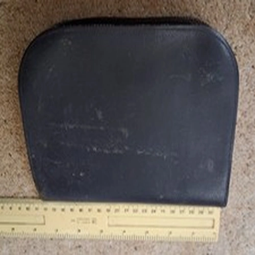 A 7 1/2 by 5 inch leather? Fly wallet with many flies.