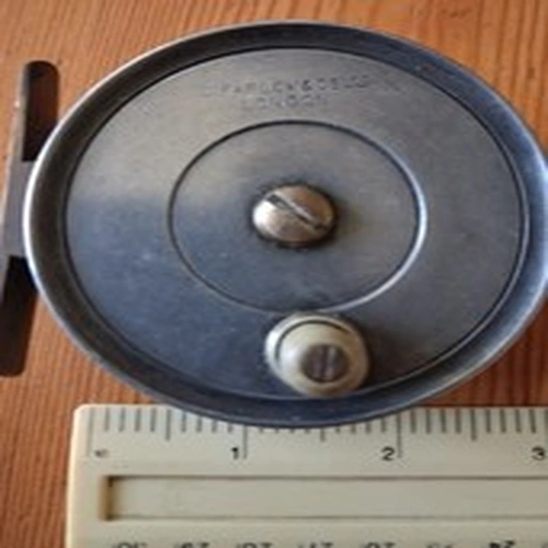 A vintage farlows trout reel 2 3/4 by 3/4 approx.