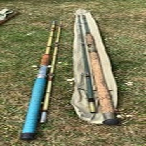 Two vintage solid Glass fishing rods approximately 50 years old