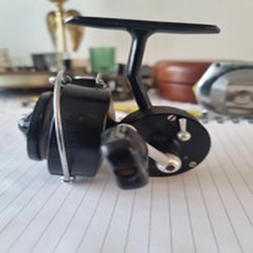 A GOOD USED VINTAGE MITCHELL  304 LIGHT SPINNING REEL