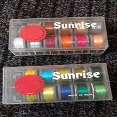 Lot 25. Fly Tying Materials.  Sunrise Dispensers X 2 And Sue Burgess Floss X 21.