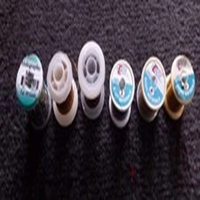 Lot 102. Fly Tying Materials. Holographic Tinsel x 4 and Wire x 2.