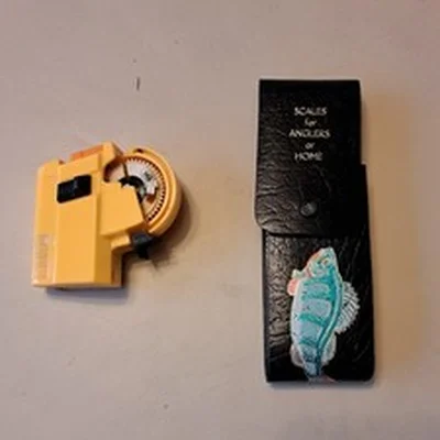 A set of cased little samson scales, and an electric hook tyer