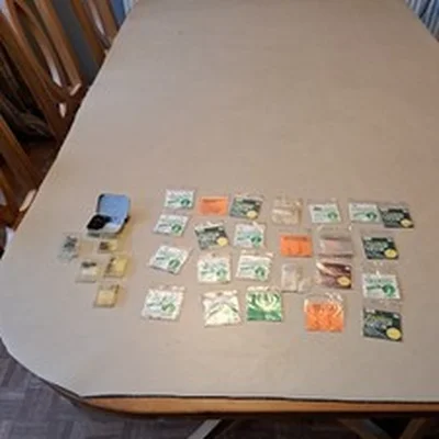 Hundreds of packaged fishing hooks in a variety of styles and sizes