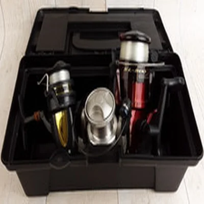 Small tackle box and 3 assorted fishing reels, pre-owned (untested)