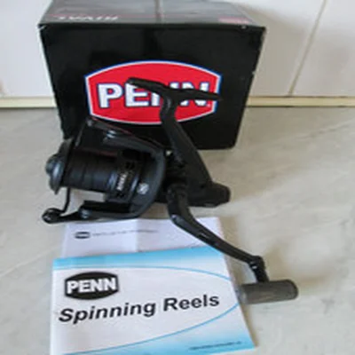 PENN RIVAL 7000LC BLACK FRONT DRAG REEL + PAPERS IN BOX IN GREAT CONDITION