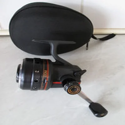DAIWA 120M HARRIER CLOSED FACE REEL  + HARD REEL CASE IN GOOD USED CONDITION.