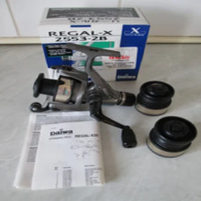 DAIWA REGAL-X 2553-2B REEL + 2 S/SPOOLS, PAPERS, IN BOX  IN GOOD USED CONDITION.