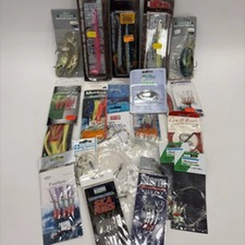 assorted sea fishing lures and tackle, including soft plastic baits and rigs