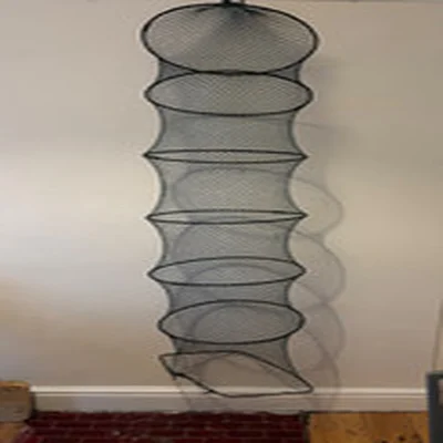 Two vintage fishing nets