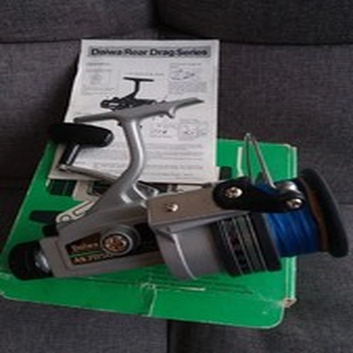 A Daiwa AS 7050 Skirted Spool Spinning Reel, original box/instructions.