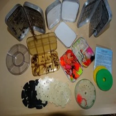 A selection of fly boxes and  leader carriers for fly fishing all good used