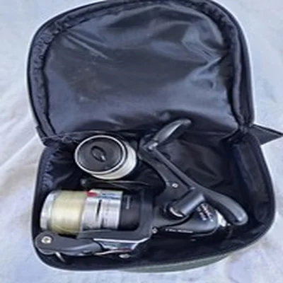Course fishing reel, Red Wolf OL-20, and padded bag.